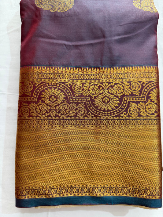Silk in Kanchipuram boarder Saree with Zari boader -royal purple or violet base, heavily embellished with elaborate gold Zari patterns