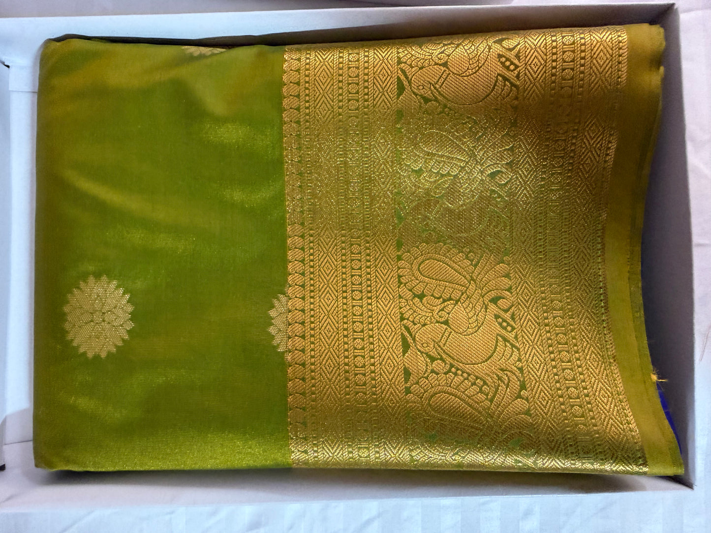 Silk in Kanchipuram boarder Saree with Zari boader -lemon green with flower buttas.