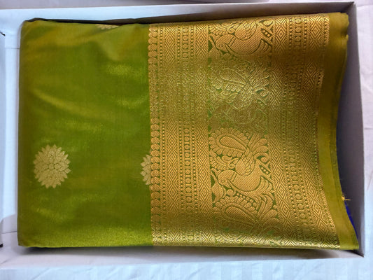 Silk in Kanchipuram boarder Saree with Zari boader -lemon green with flower buttas.
