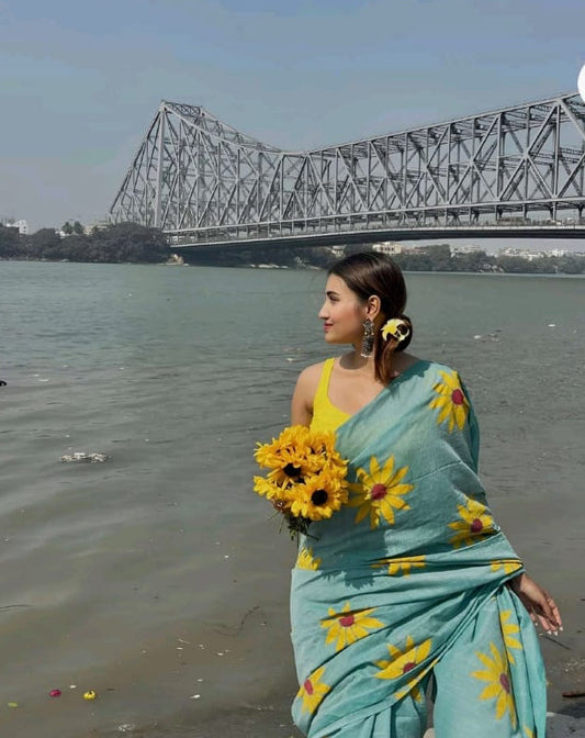 linen saree with sky blue sunflow flower design
