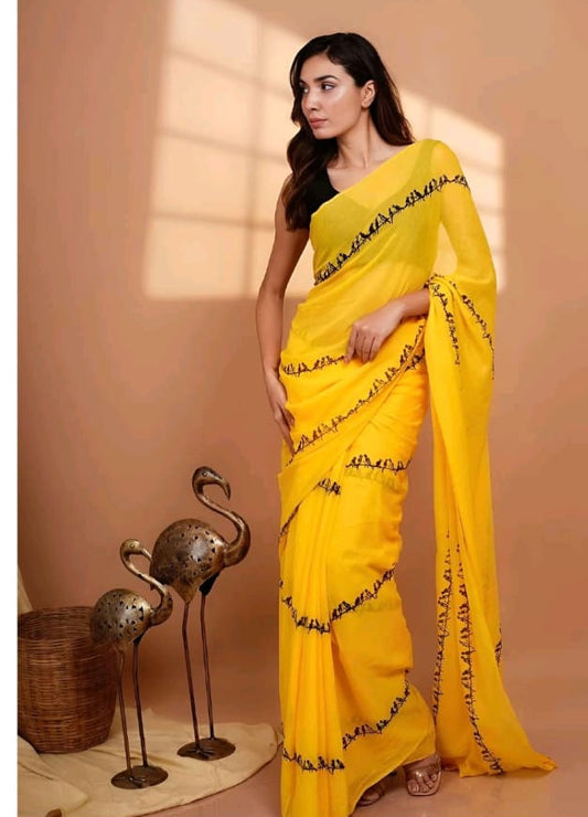 linen yellow saree with black zigzag strips