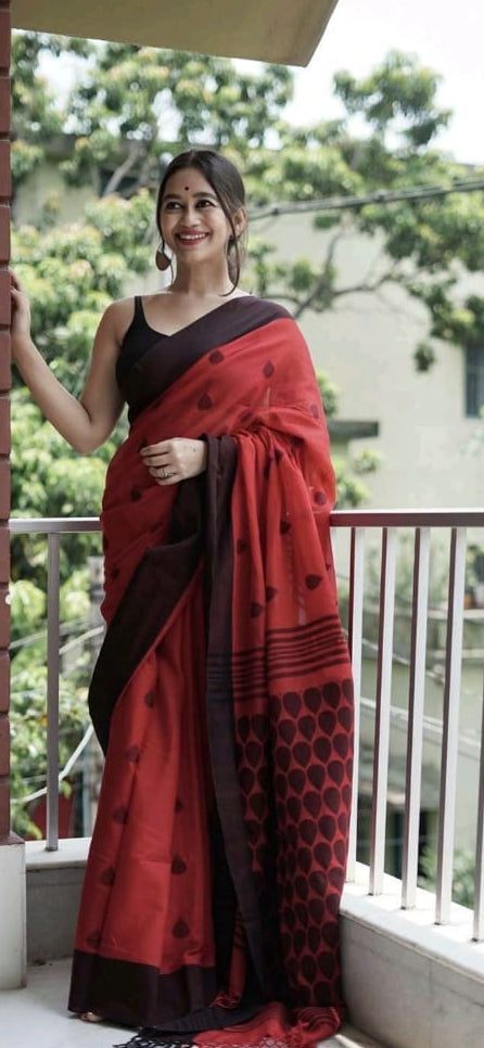linen saree with red saree with black buttas